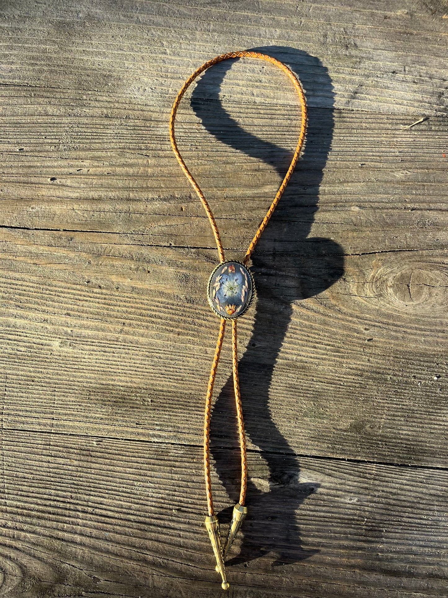 30mm blue eye, manzanita, and grass on burnt charcoal