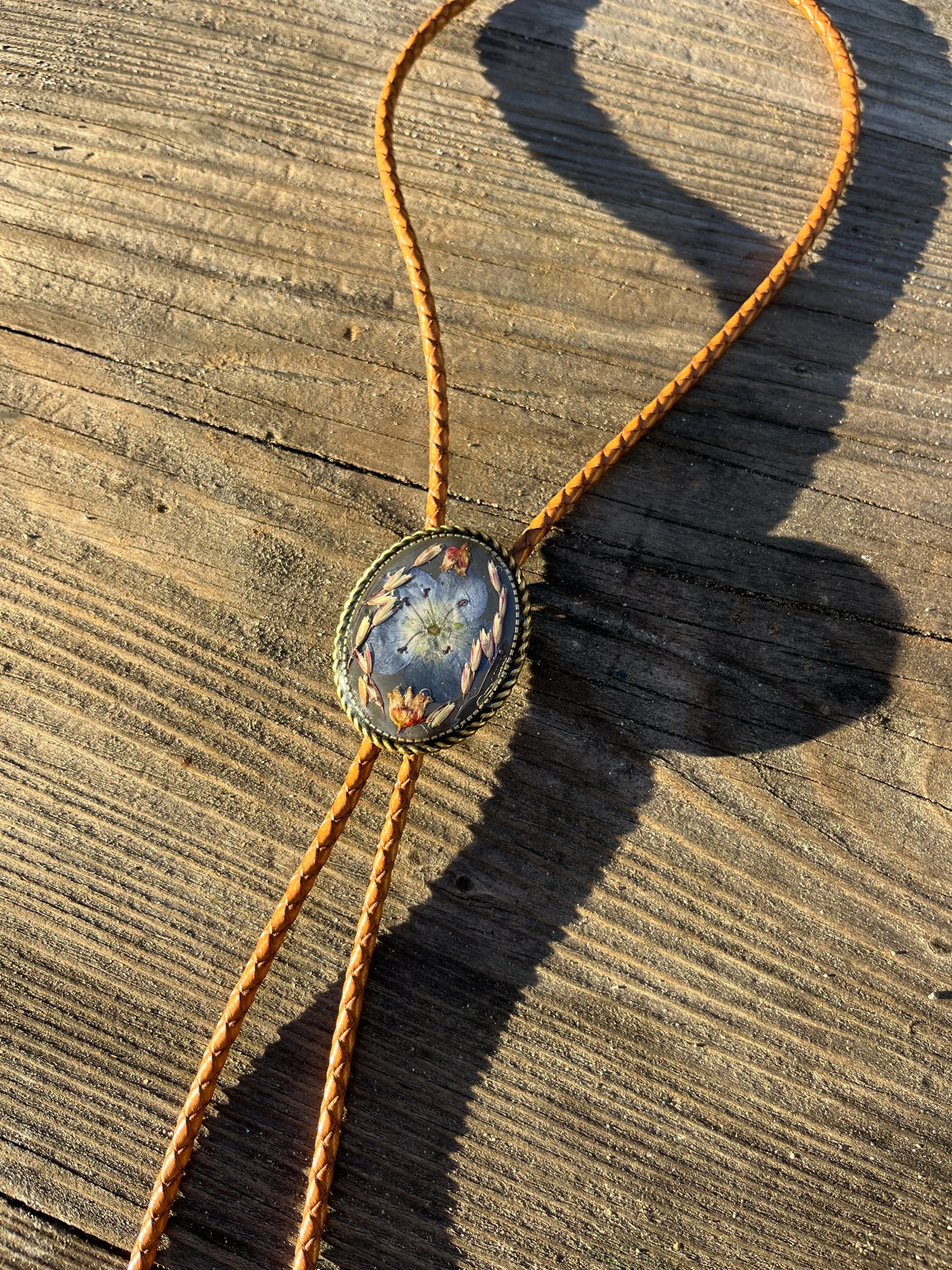 30mm blue eye, manzanita, and grass on burnt charcoal